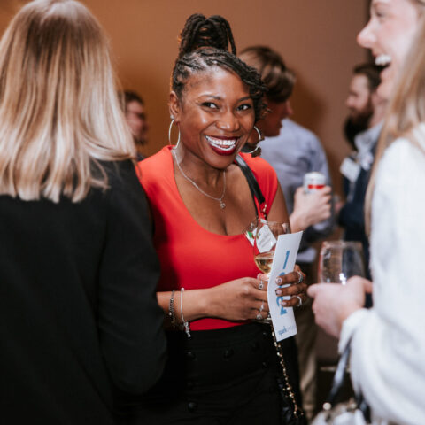 Associate Board member Ashley Bailey sharing laughs with fellow changemakers at our annual spring event.